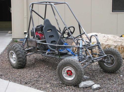 The finished car outside the shop, roll cage and suspension complete